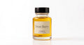 Frost Berry perfume oil concentrate in a glass bottle with black cap and cream label