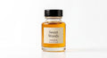 Sweet Woods perfume oil concentrate in a glass bottle by Ambre Royale